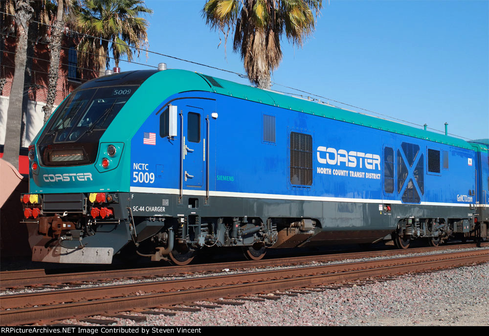 Coaster SC44 NCTC #5009 pushes train #636 towards San Diego 's "Santa Fe Depot".